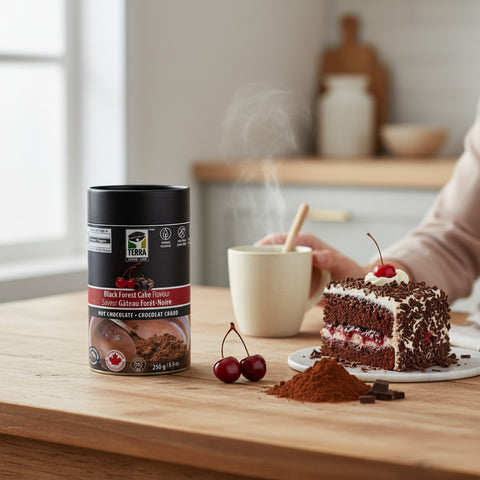 Bean Here Bean There Coffee & Cocoa Terra Black Forest Cake hot chocolate tin next to a slice of cherry cake.