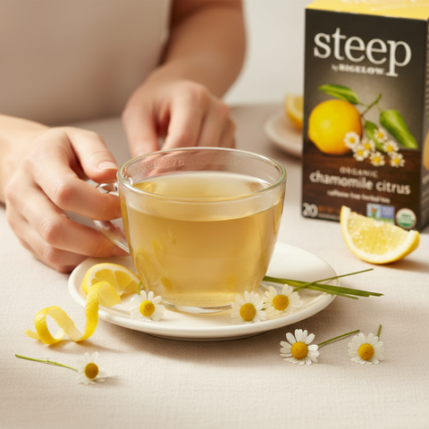 Bean Here Bean There Coffee & Cocoa Steep by Bigelow Organic Chamomile Citrus tea in a glass cup with lemon garnish