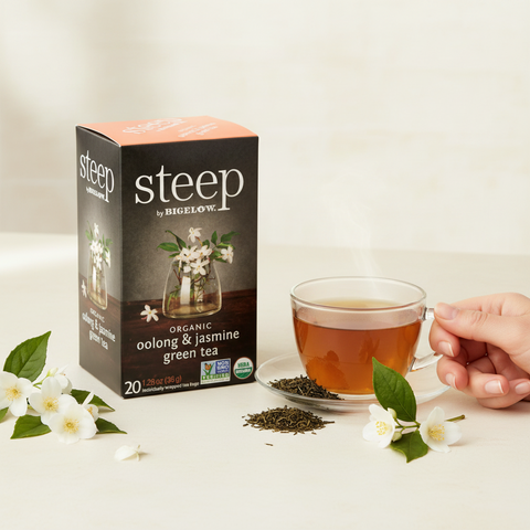 Bean Here Bean There Coffee & Cocoa Steep by Bigelow organic oolong and jasmine green tea box with a cup of tea