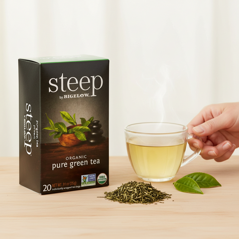 Bean Here Bean There Coffee & Cocoa Steep by Bigelow organic decaffeinated green tea box with a steaming cup of tea